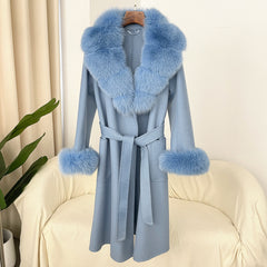 Light blue coat with fur collar and cuffs on a chair against a white curtain background