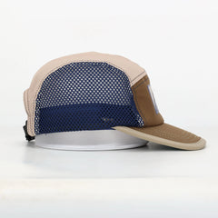 Beige and navy cap on a white background