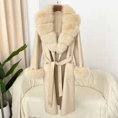 Beige coat with fur collar and cuffs on a chair against a white wall