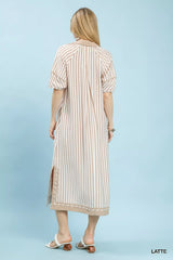 Woman wearing a striped dress on a light blue background
