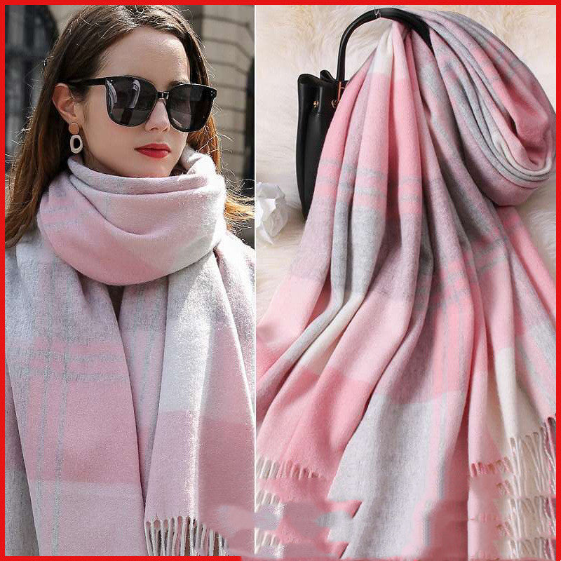Woman wearing a pink and gray plaid scarf with a close-up of the scarf on a red background.