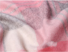 Close-up of a pink and gray plaid fabric texture