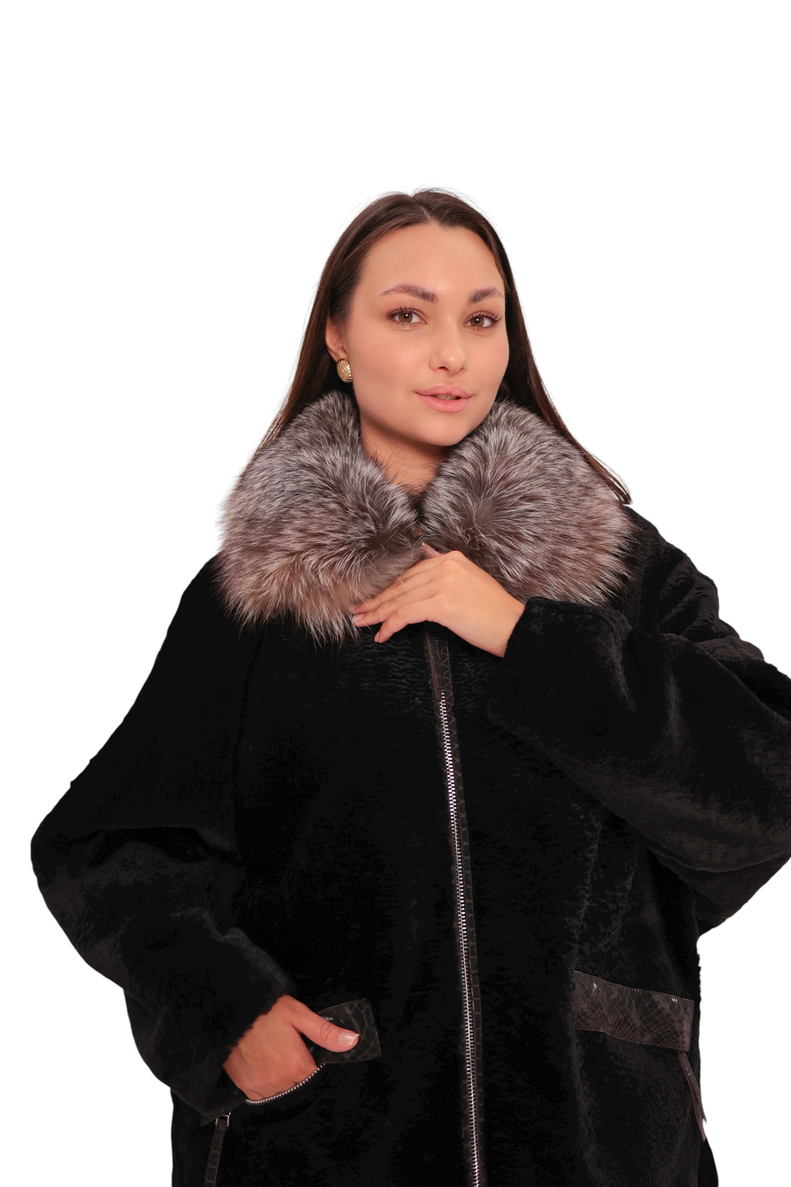 Woman wearing a black coat with fur collar on a white background