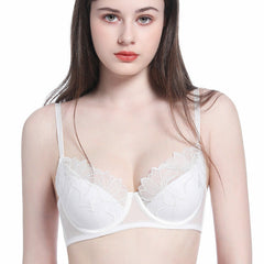 Woman wearing a white bra on a white background