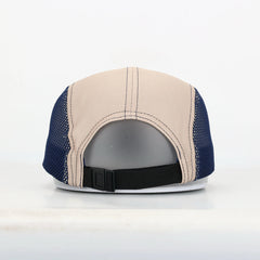 Back view of a cap with beige and blue design on a white background