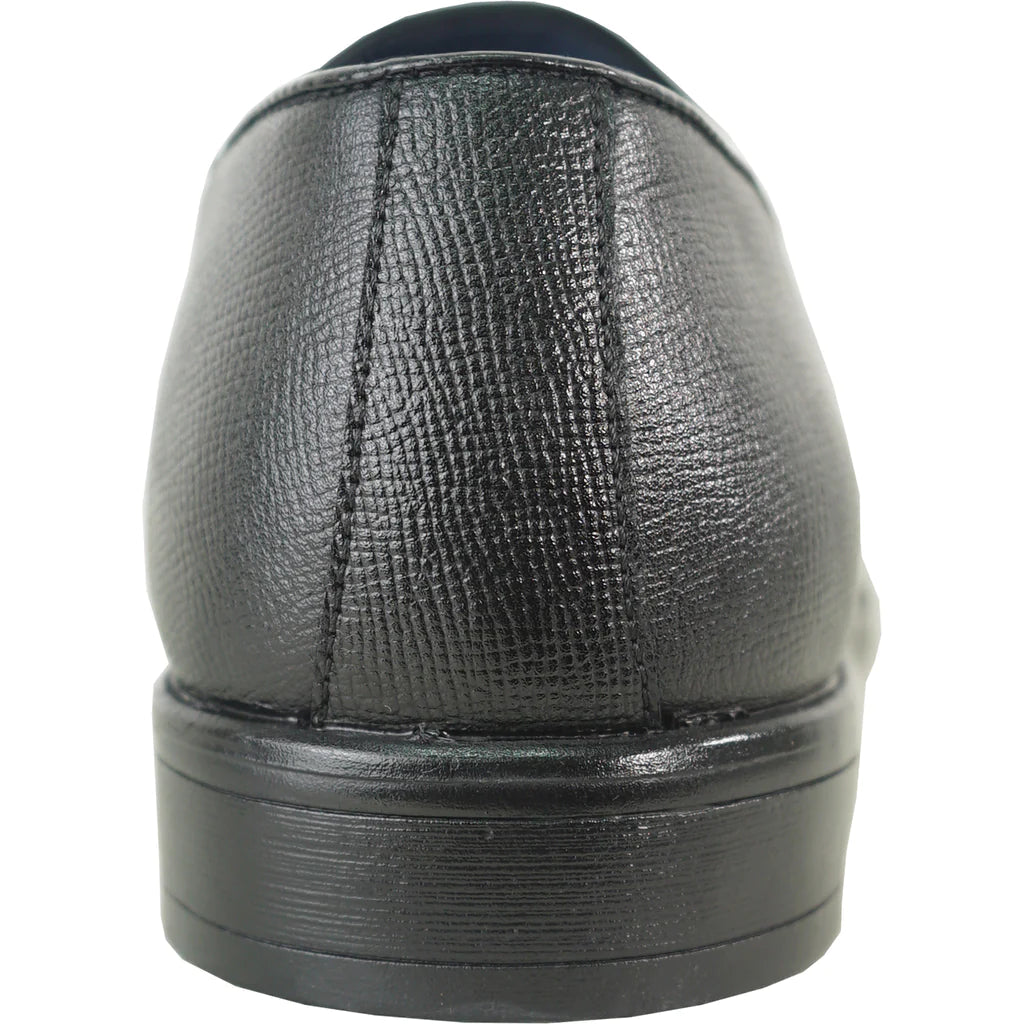 Close-up of a black leather shoe on a white background