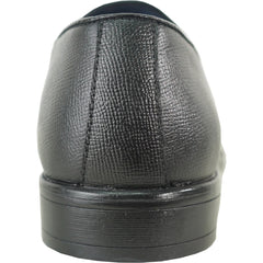 Close-up of a black leather shoe on a white background