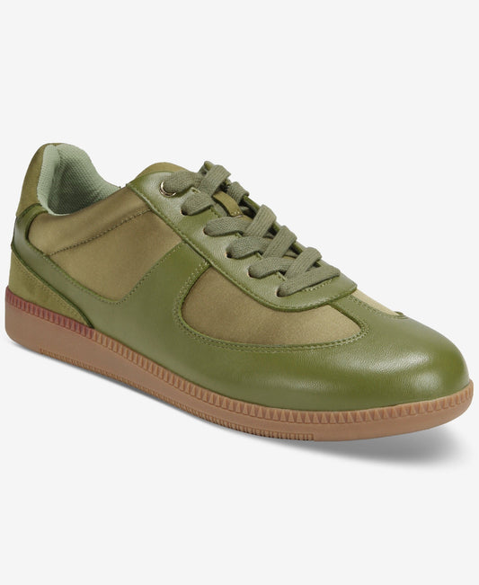 Green sneaker with brown sole on a white background