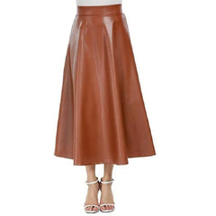 A person wearing a high-waisted brown PU leather long skirt with a flared design, paired with heels.