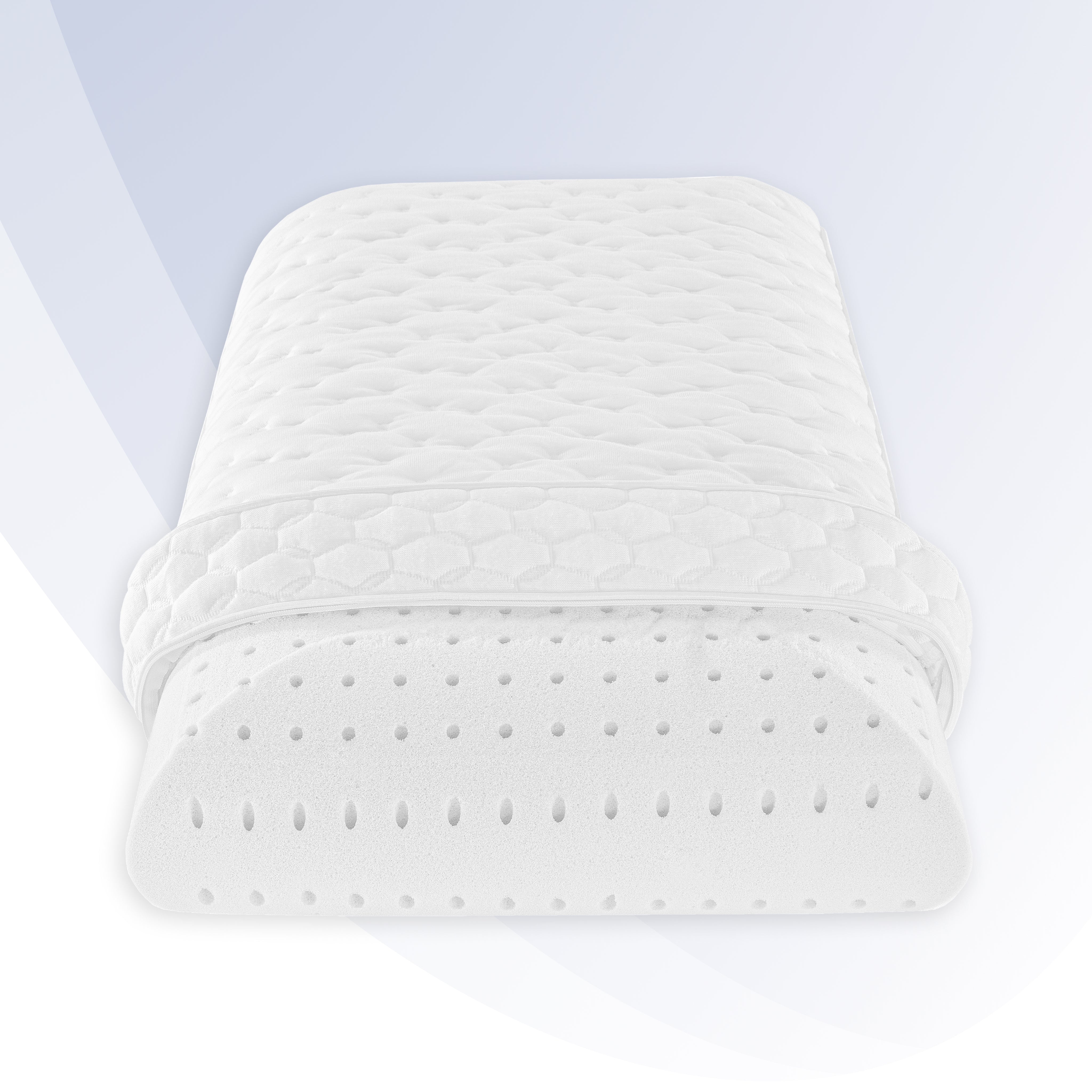 White quilted pillow on a light gray background