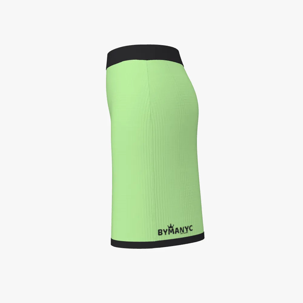 Green athletic skirt with black band and 'BY MANYC' branding on a white background
