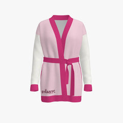 Pink and white robe with a belt on a light gray background