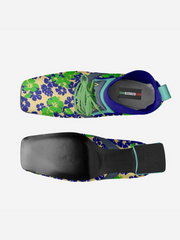 Colorful shoe with floral pattern and black sole on a white background