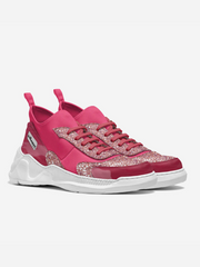 Pink sneakers with glittery accents on a white background