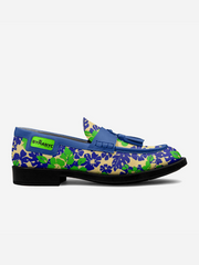 Pair of loafers with floral pattern and blue accents on a white background
