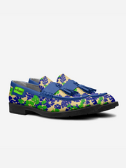 Colorful loafers with floral pattern and blue accents on a white background