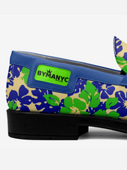 Floral-patterned shoe with a blue accent and 'BY MANCY' label on a white background