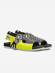 Pair of sandals with yellow and gray design on a white background