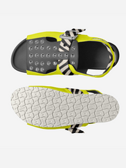 Flip-flop sandal with zebra pattern strap and textured sole on a white background