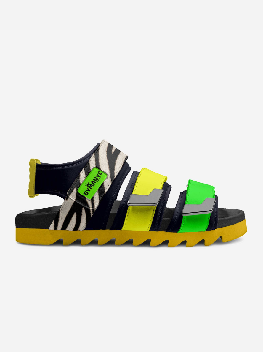 Colorful sandal with zebra pattern and green label on a white background