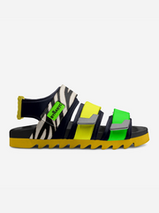 Colorful sandal with zebra pattern and green label on a white background