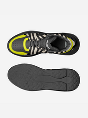 Top and bottom views of a black and gray sneaker with yellow accents on a white background