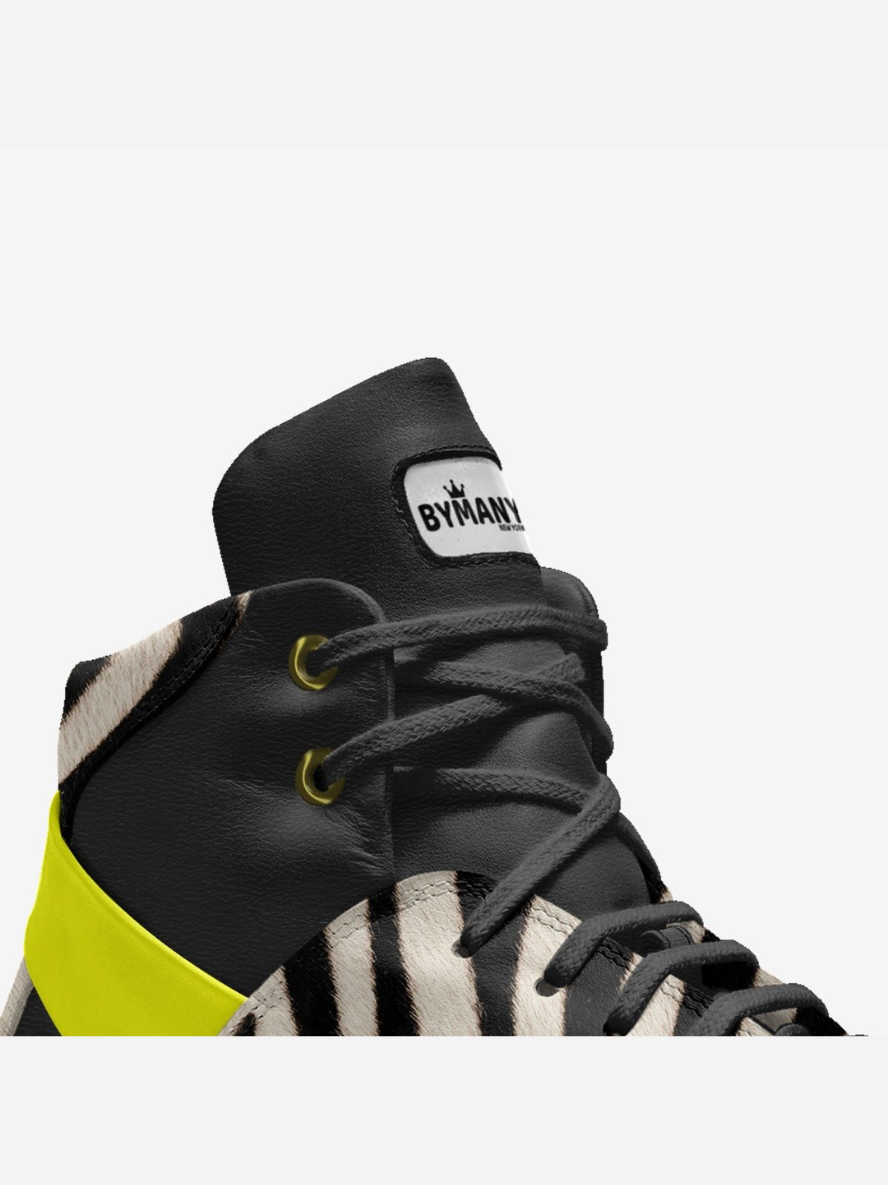 Black and yellow sneaker with 'BYMANN' branding on a white background