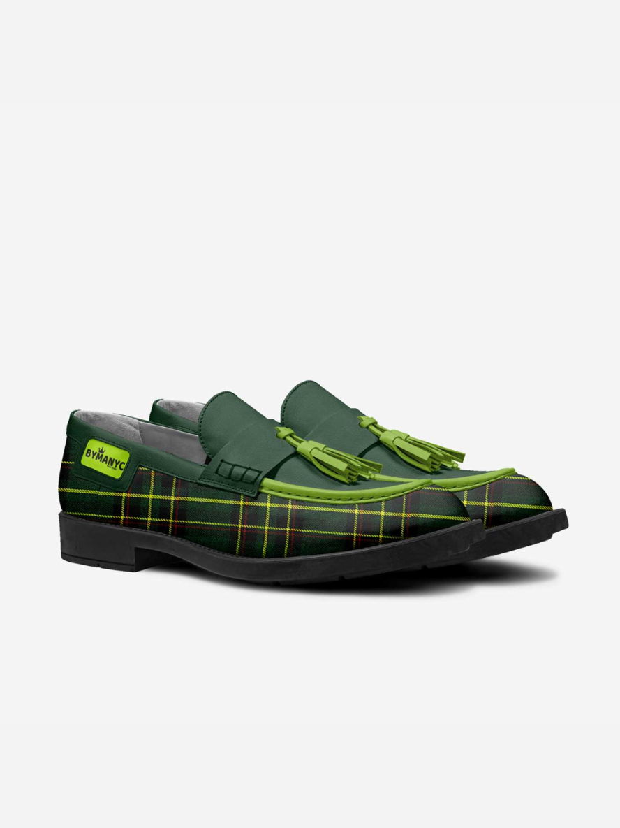 Green loafers with tartan pattern on a white background
