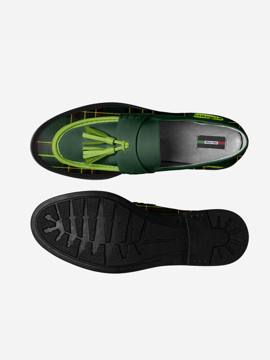 Green loafers with tassel on a white background