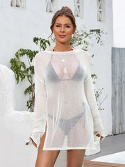 Woman wearing a sheer white cover-up with a blurred background