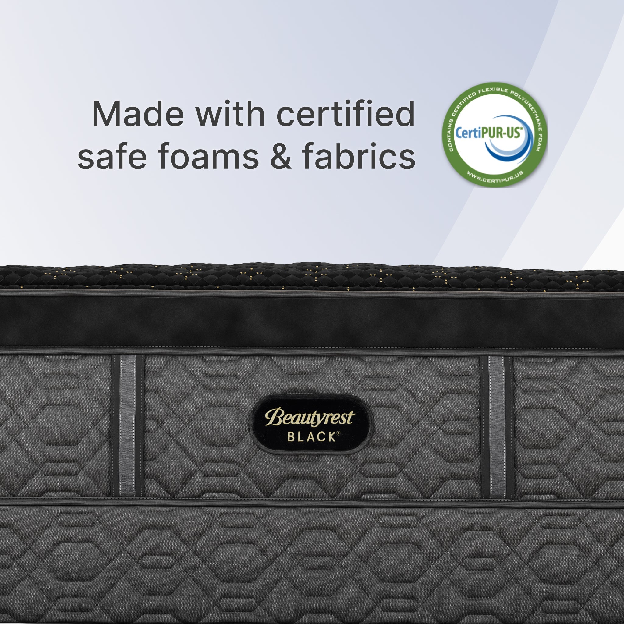 Gray mattress with Beautyrest Black logo and CertiPUR-US certification label on a light gray background