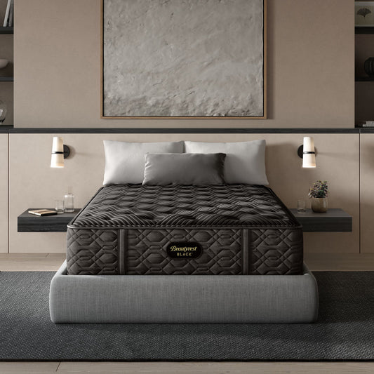 Gray mattress on a bed in a modern bedroom setting