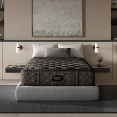 Gray mattress on a bed in a modern bedroom setting