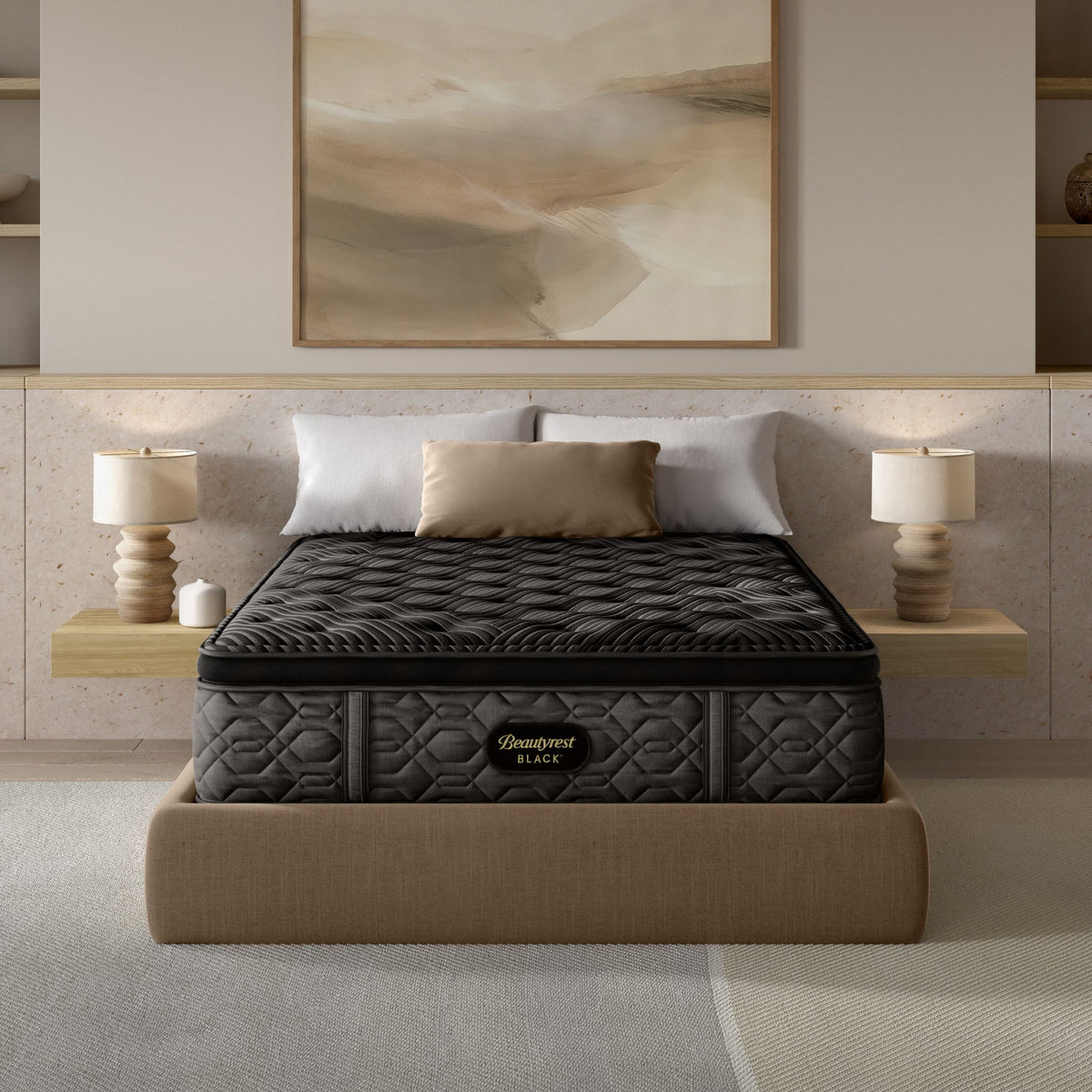 Gray mattress on a bed in a modern bedroom setting with lamps and artwork.