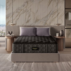 Black mattress on a bed in a modern bedroom with marble wall.