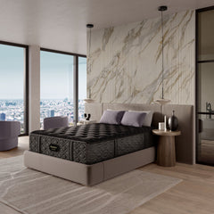 Bedroom with a large bed and marble wall