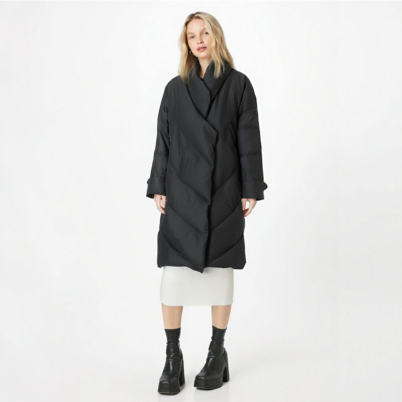 Woman wearing a black coat on a white background