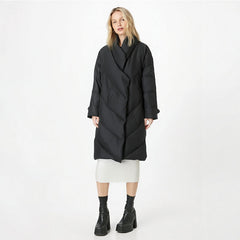 Woman wearing a black coat on a white background