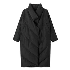 Black quilted coat on a white background