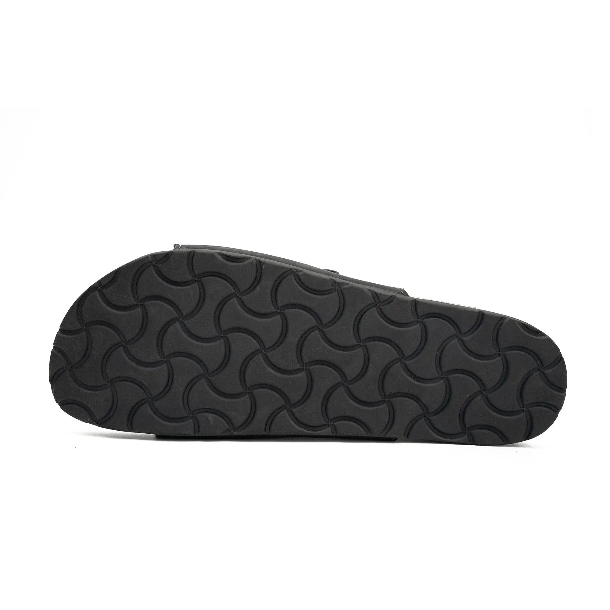 Black sandal sole with wavy pattern on a white background