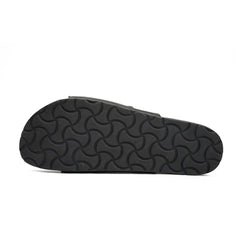Black sandal sole with wavy pattern on a white background
