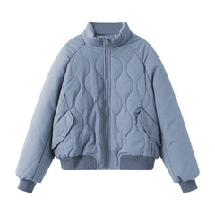 Light blue quilted jacket on a white background