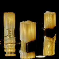 Decorative lampshades with a ribbed texture on a black background