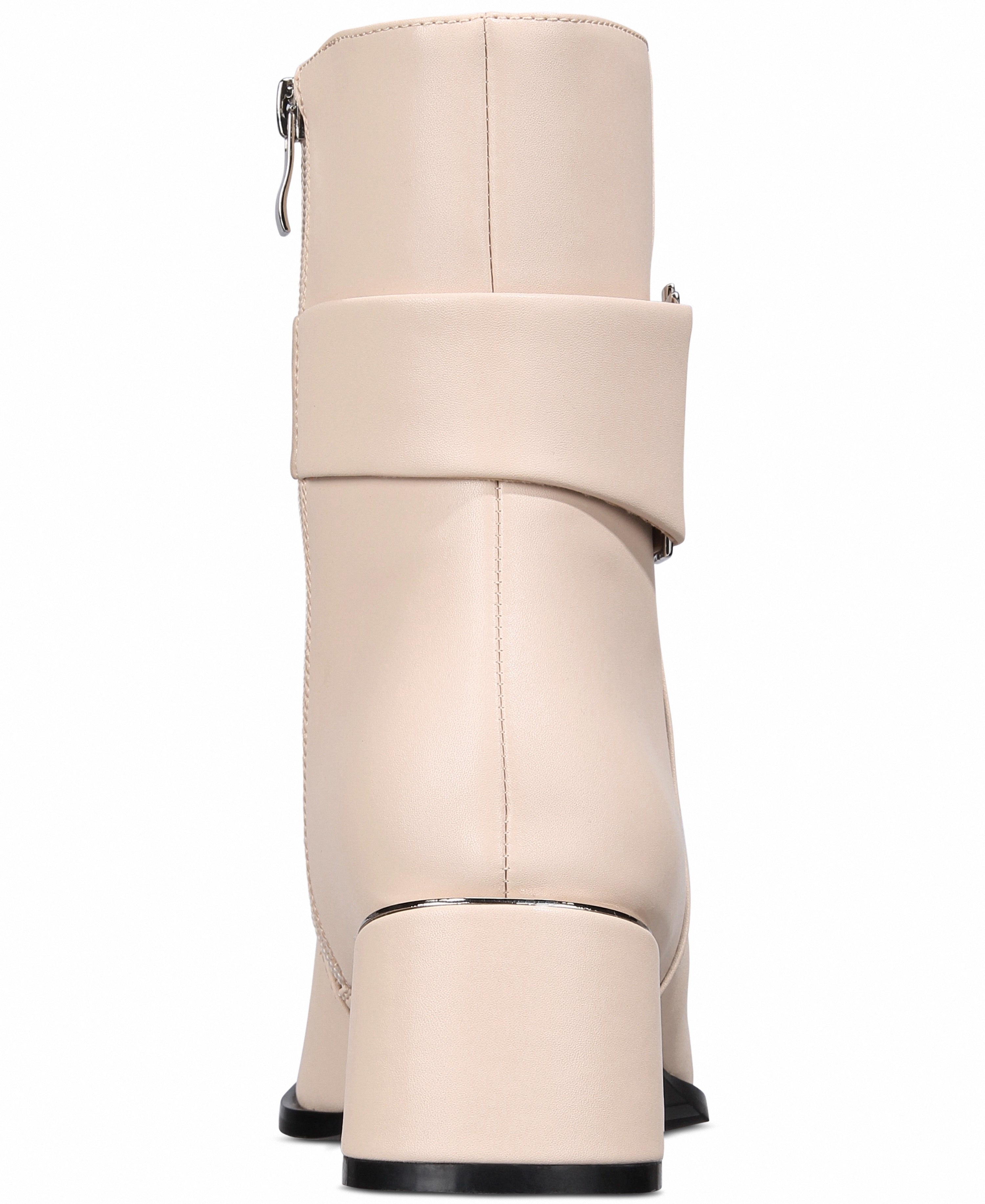 Beige knee-high boot with a block heel on a white background