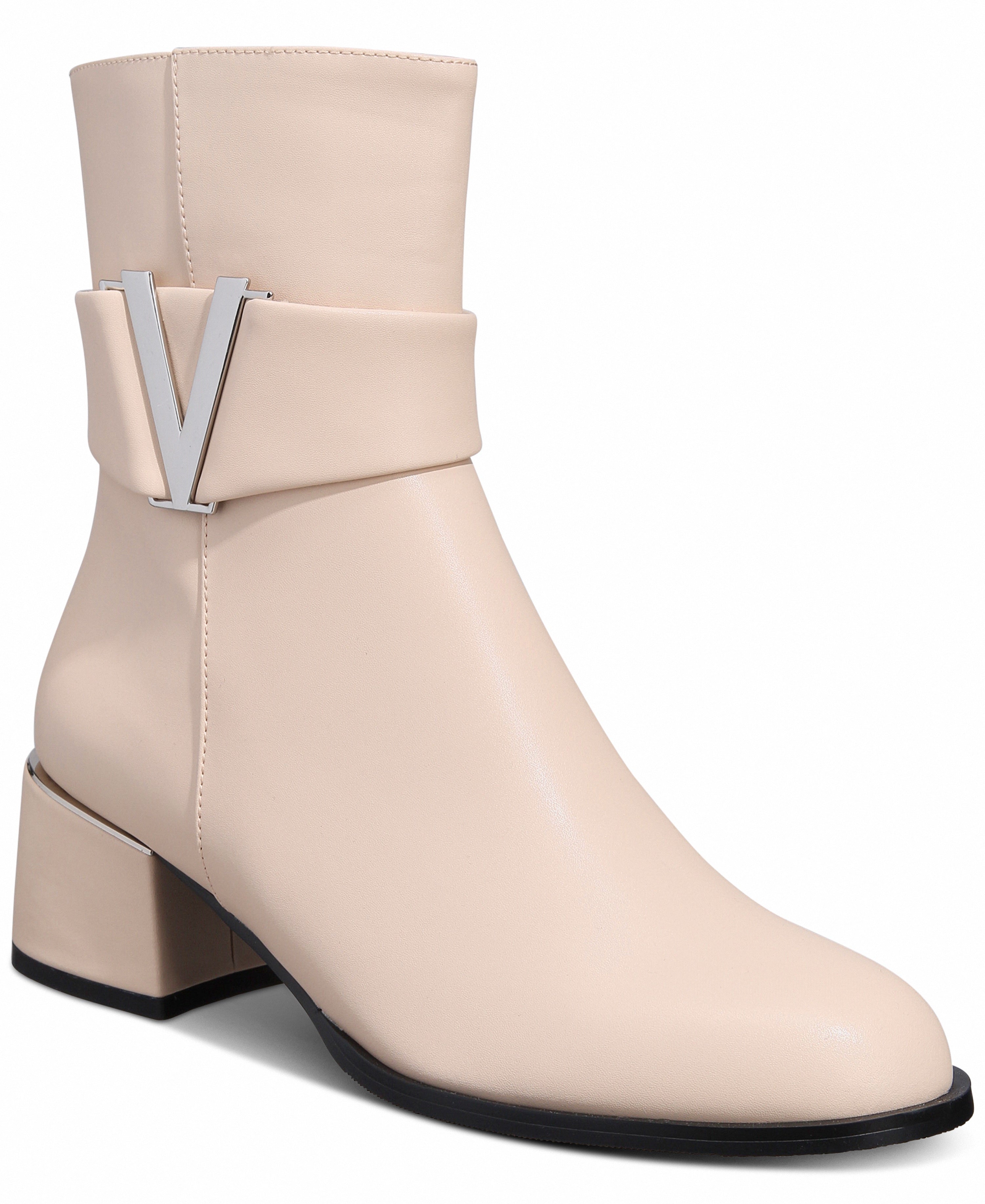 Beige ankle boot with a block heel on a white background