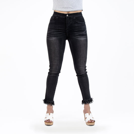 Black jeans worn by a person on a white background