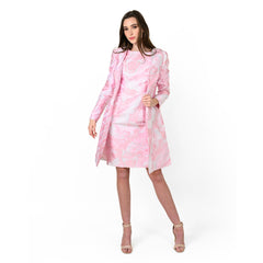 Woman wearing a pink floral dress on a white background