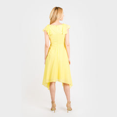 Woman wearing a yellow dress on a white background