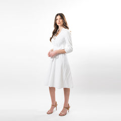 Woman wearing a white dress on a white background