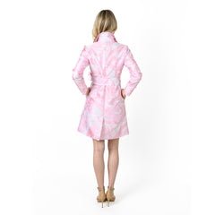 Woman wearing a pink and white tie-dye coat on a white background